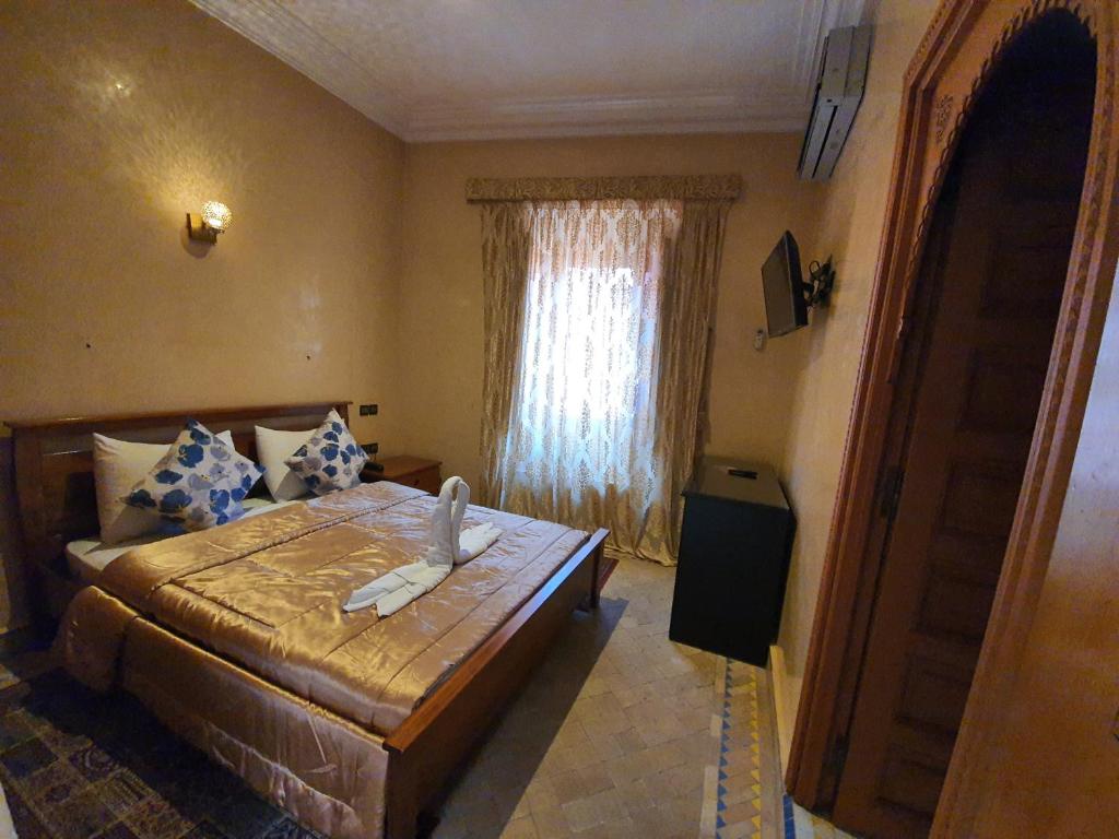 Postel nebo postele na pokoji v ubytování Riad Zaki