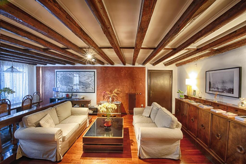 a living room with two couches and a table at San Giacomo Venezia in Venice