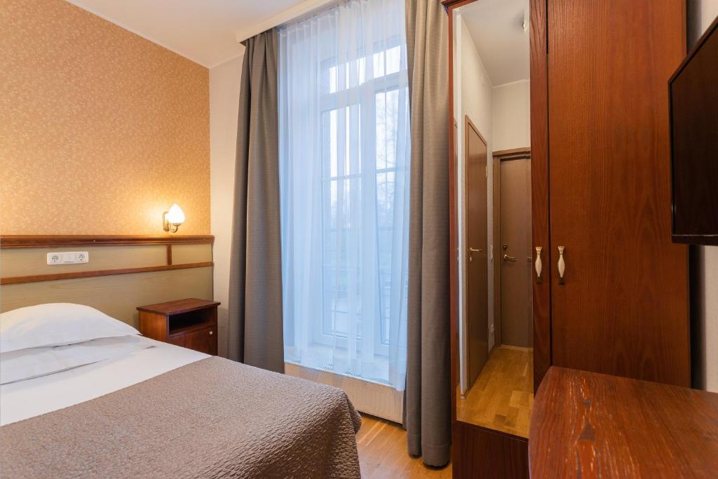 Postel nebo postele na pokoji v ubytování Hotel Villa Wesset