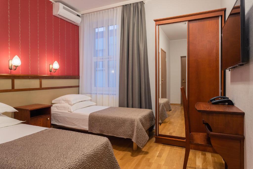 Postel nebo postele na pokoji v ubytování Hotel Villa Wesset