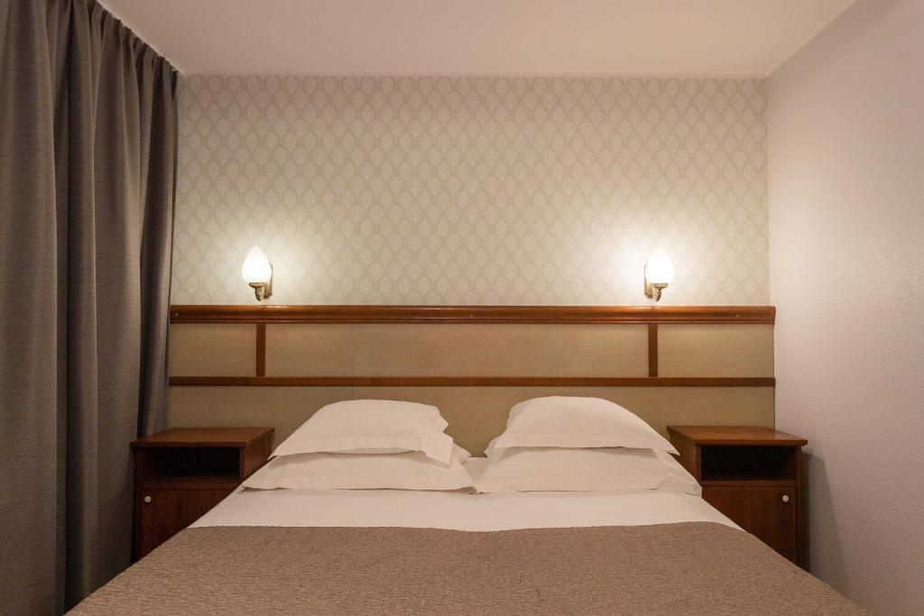 Postel nebo postele na pokoji v ubytování Hotel Villa Wesset