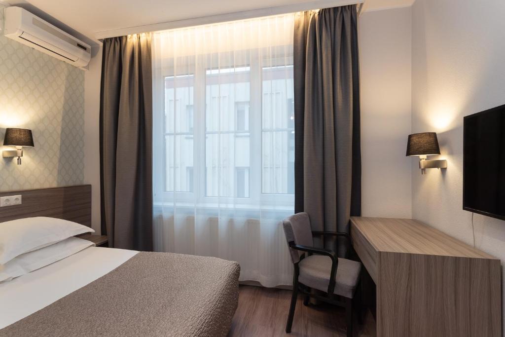 Postel nebo postele na pokoji v ubytování Hotel Villa Wesset