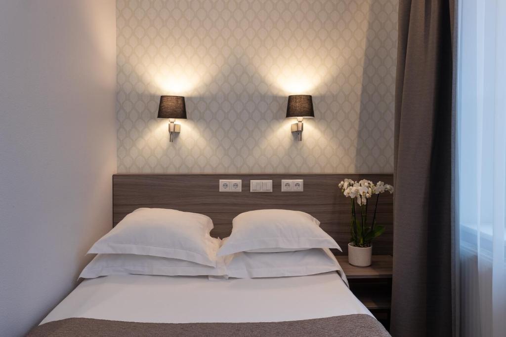 Postel nebo postele na pokoji v ubytování Hotel Villa Wesset