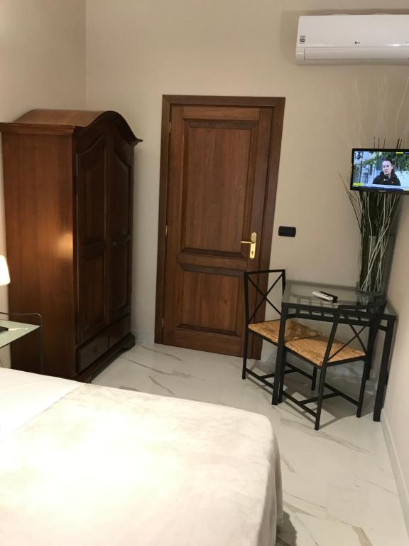 Postel nebo postele na pokoji v ubytování Hotel Paola