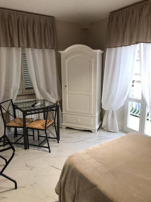 Postel nebo postele na pokoji v ubytování Hotel Paola