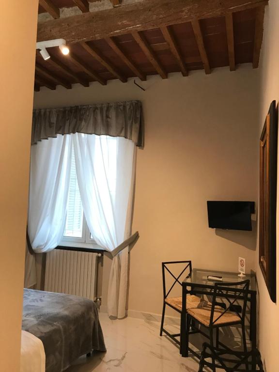 TV a/nebo společenská místnost v ubytování Hotel Paola