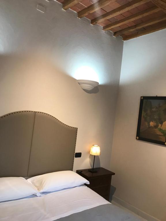 Postel nebo postele na pokoji v ubytování Hotel Paola