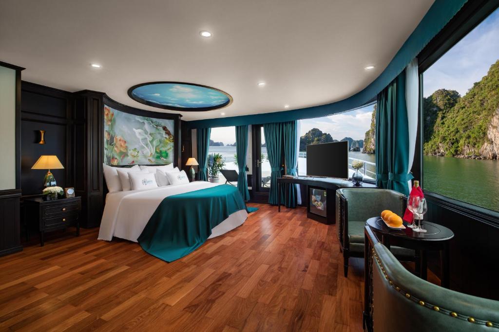 a bedroom with a bed and a view of the water at Aspira Cruise in Ha Long