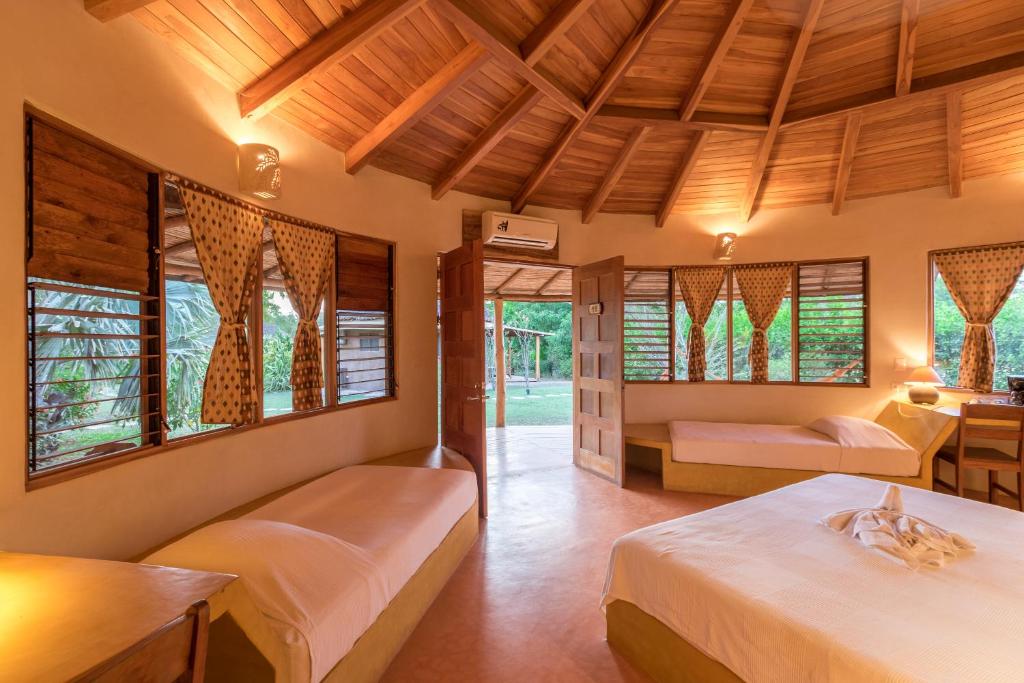 Postel nebo postele na pokoji v ubytování Hotel Playa Negra