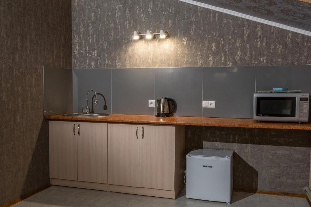 Kuchyň nebo kuchyňský kout v ubytování Hotel UNENEGE