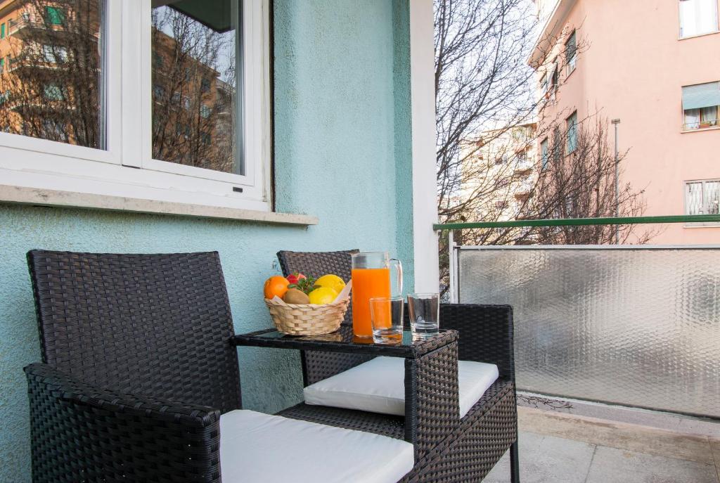 a table with a basket of fruit on a balcony at Piccolo Hotel Boutique in Rome