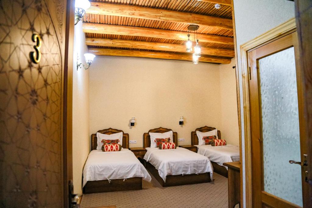 Säng eller sängar i ett rum på Old Gate Hotel