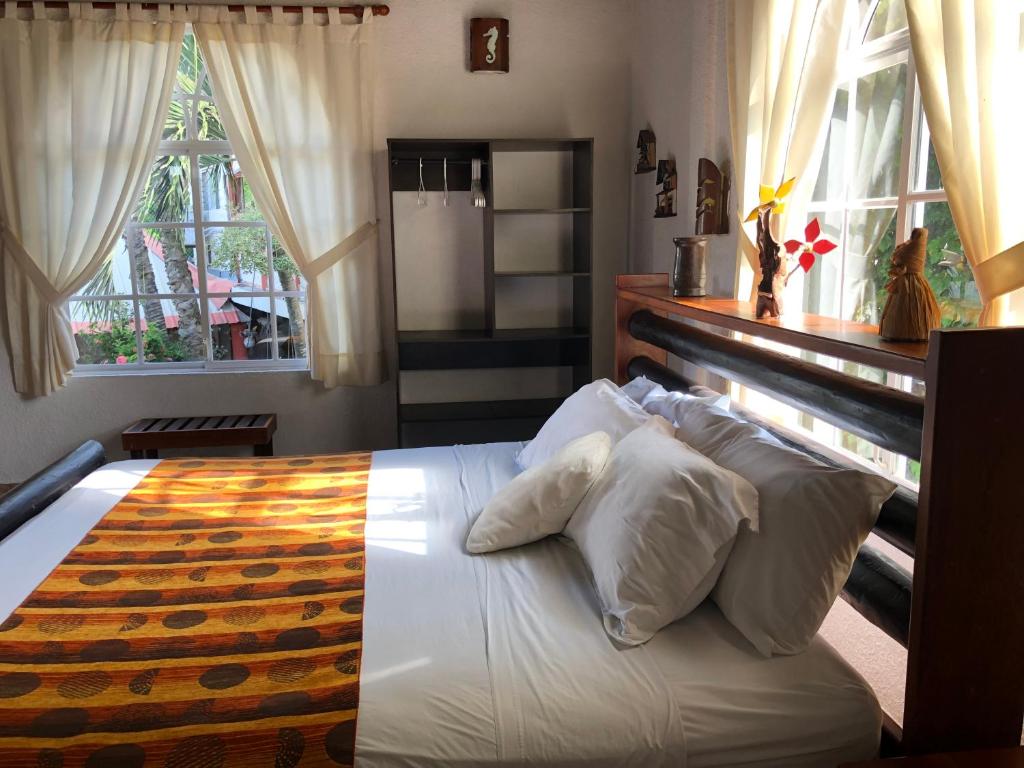 Postel nebo postele na pokoji v ubytování Hotel Puerto Gaviota