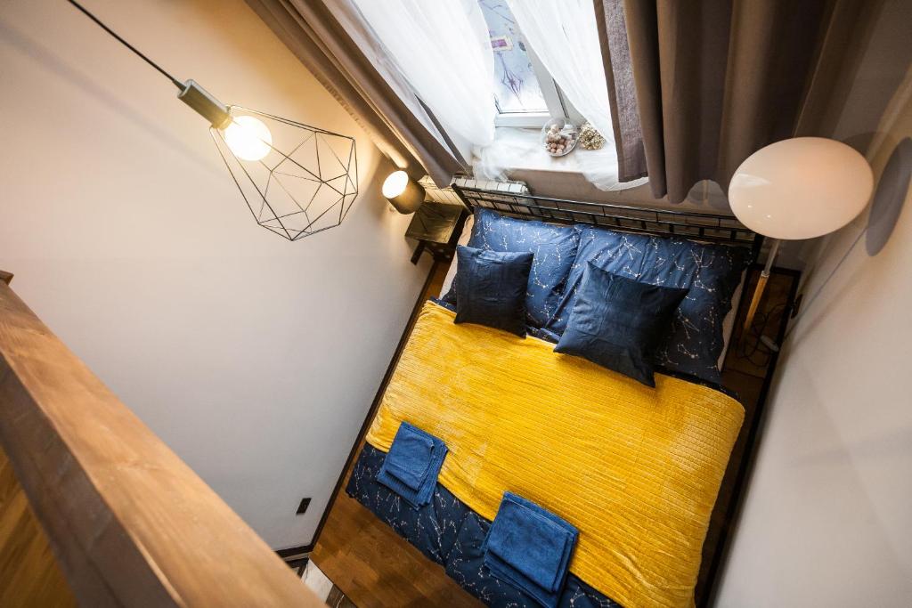 Posteľ alebo postele v izbe v ubytovaní Stylish Apartment in Krakow Old Town