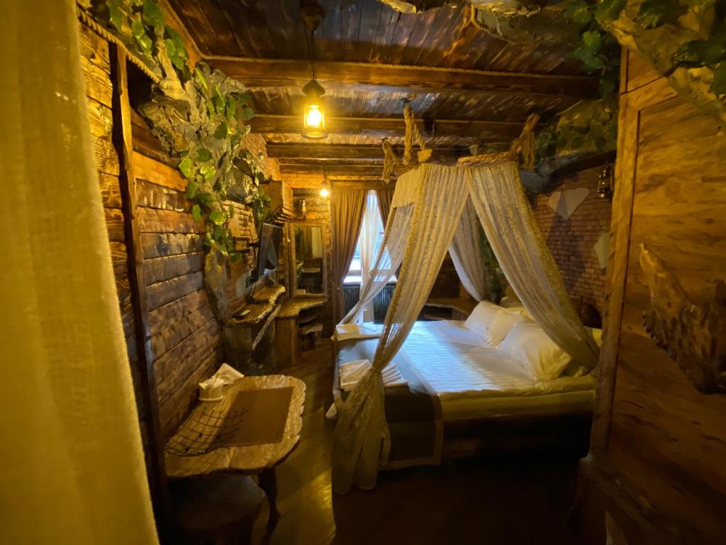 Postel nebo postele na pokoji v ubytování Boutique Fantasy