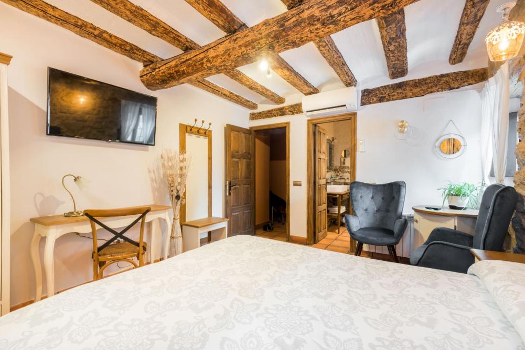 Postel nebo postele na pokoji v ubytování Posada del Rodeno