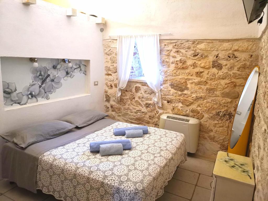 Łóżko lub łóżka w pokoju w obiekcie Trullo Madia e Dimora Giorgio