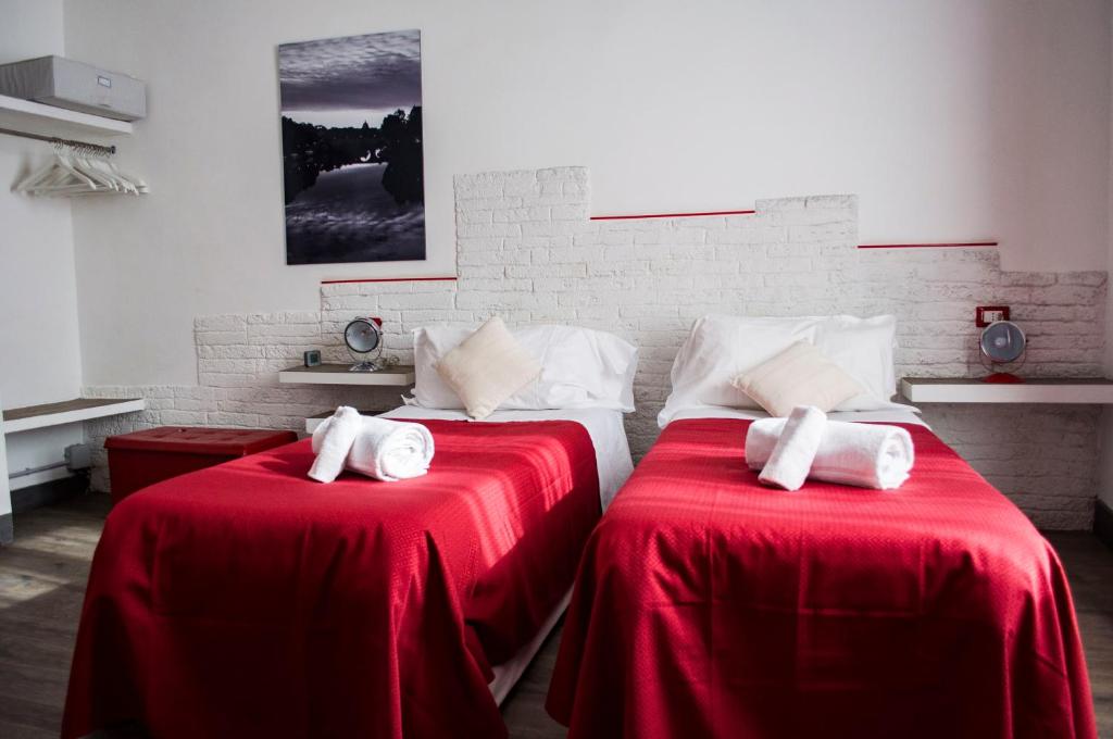 Posteľ alebo postele v izbe v ubytovaní Relais Cola Di Rienzo