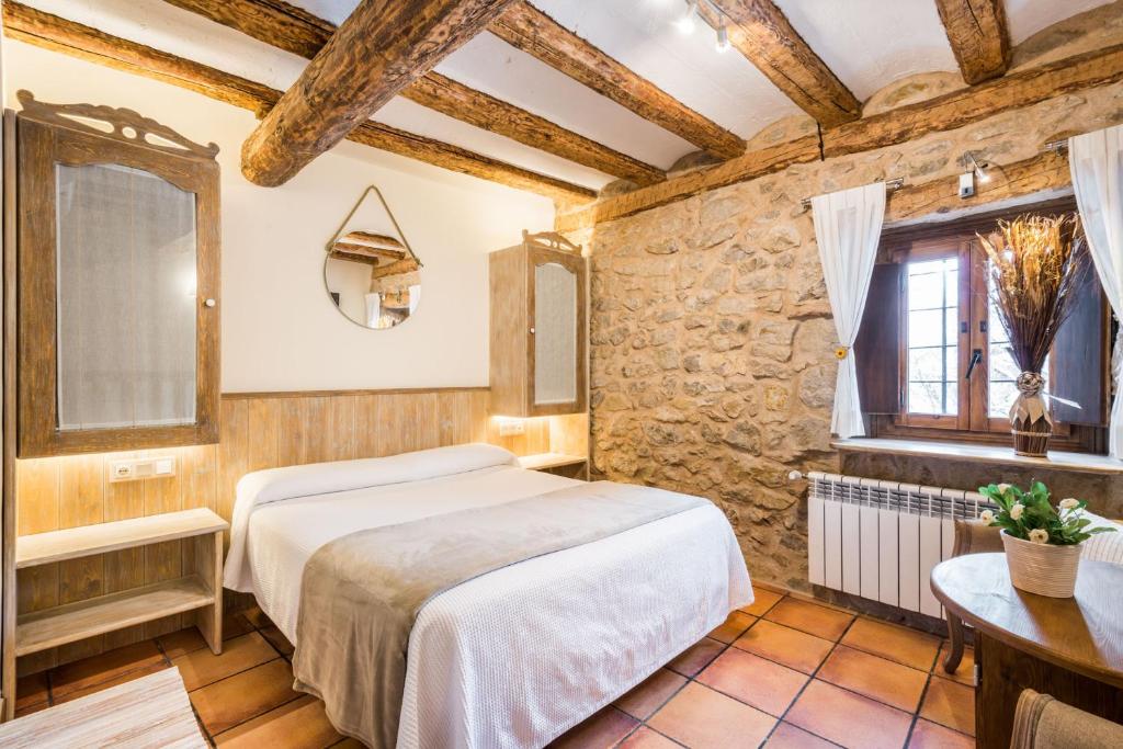 Postel nebo postele na pokoji v ubytování Posada del Rodeno