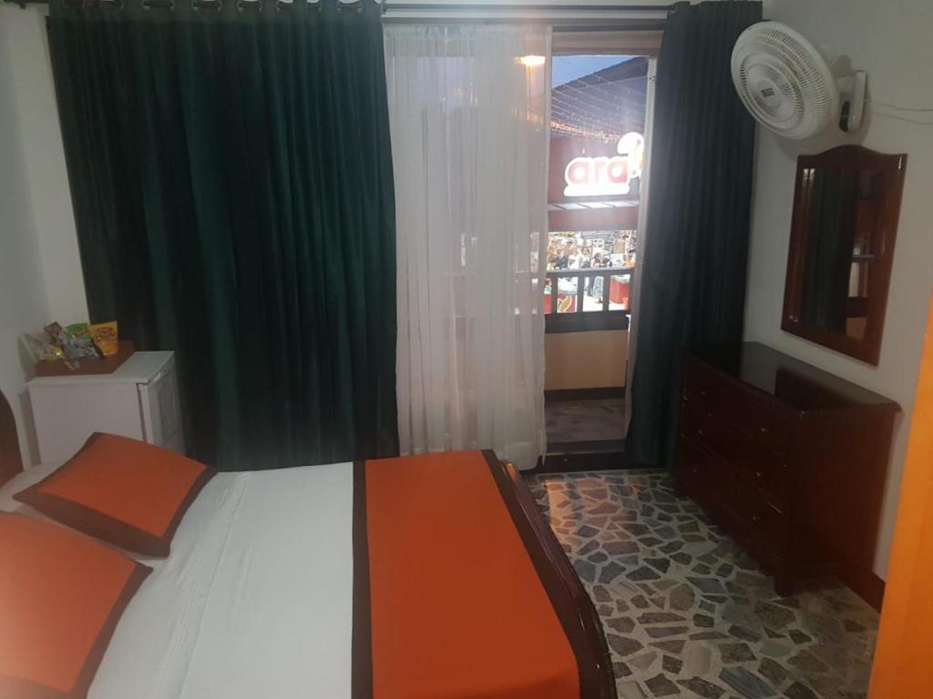 Postel nebo postele na pokoji v ubytování Hotel Tequendama