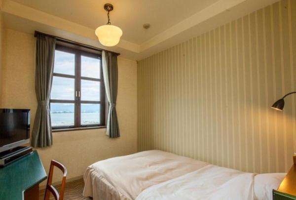 TV a/nebo společenská místnost v ubytování Kitabiwako Hotel Grazie