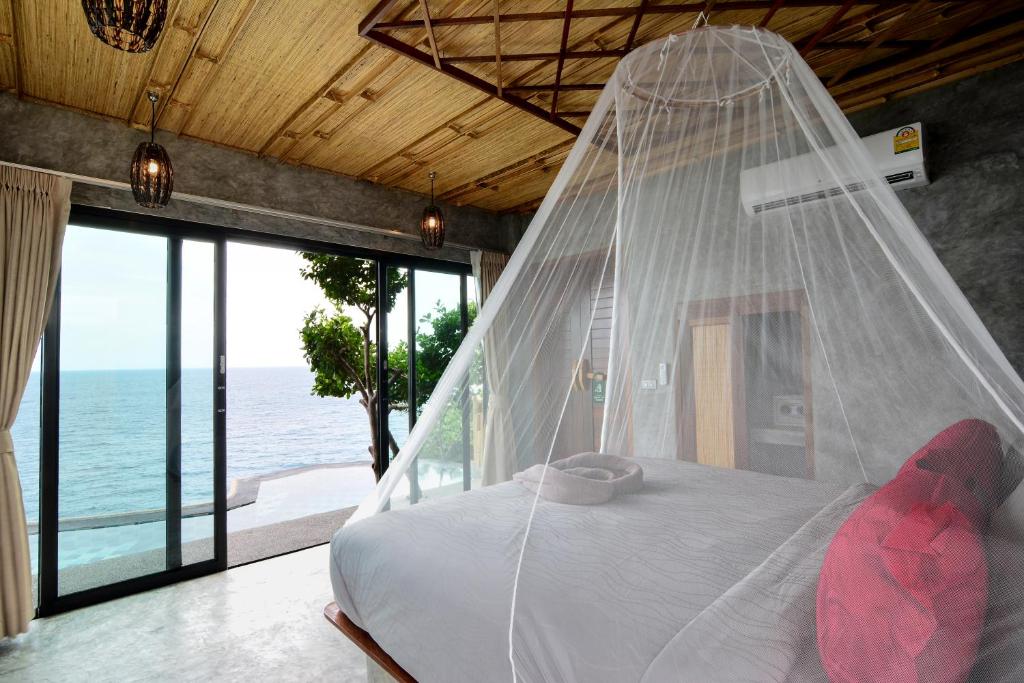 Postel nebo postele na pokoji v ubytování Sai Daeng Resort