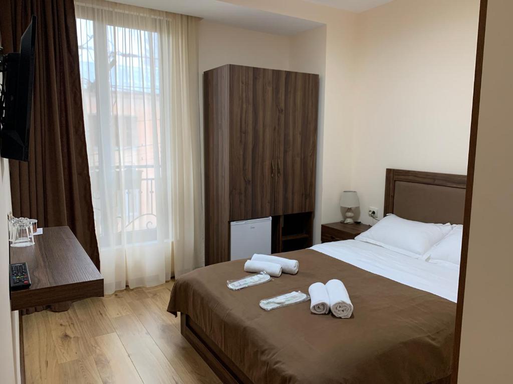 Postel nebo postele na pokoji v ubytování Gala Boutique Hotel
