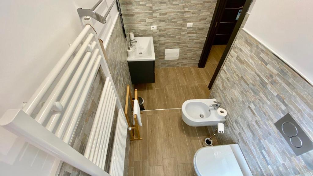 a small bathroom with a sink and a toilet at Cala Portavecchia in Monopoli