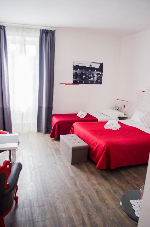 Posteľ alebo postele v izbe v ubytovaní Relais Cola Di Rienzo
