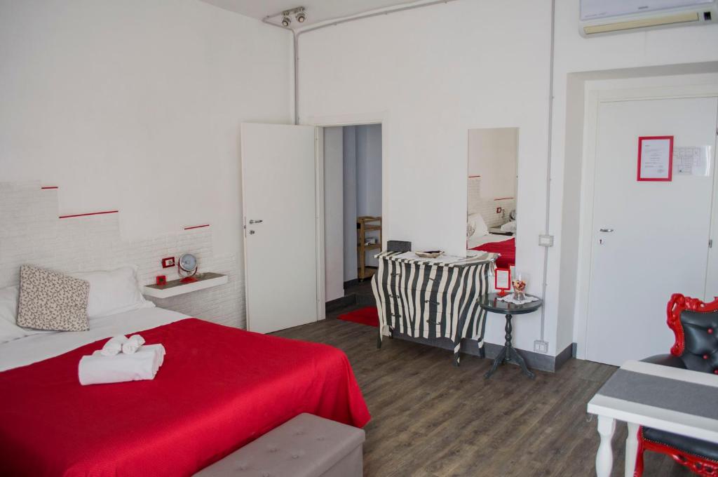 Posteľ alebo postele v izbe v ubytovaní Relais Cola Di Rienzo