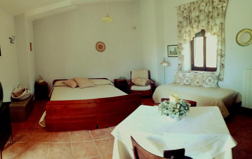 מיטה או מיטות בחדר ב-Agriturismo Tre Santi