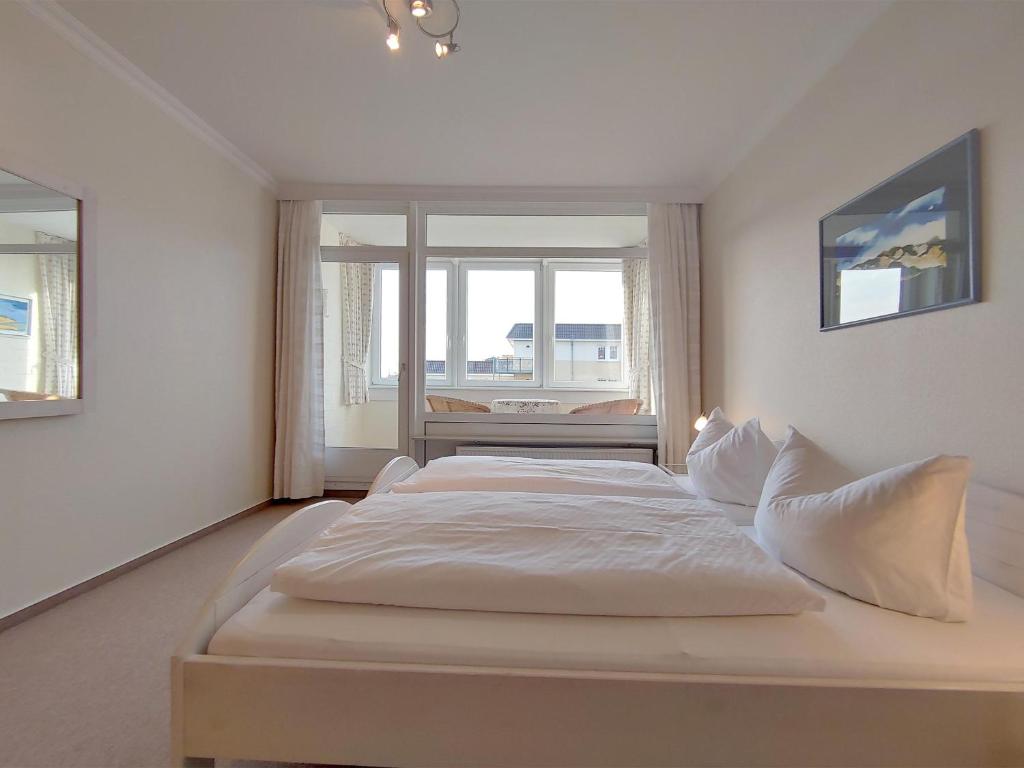Postel nebo postele na pokoji v ubytování Ferienwohnung *Hafenblick*