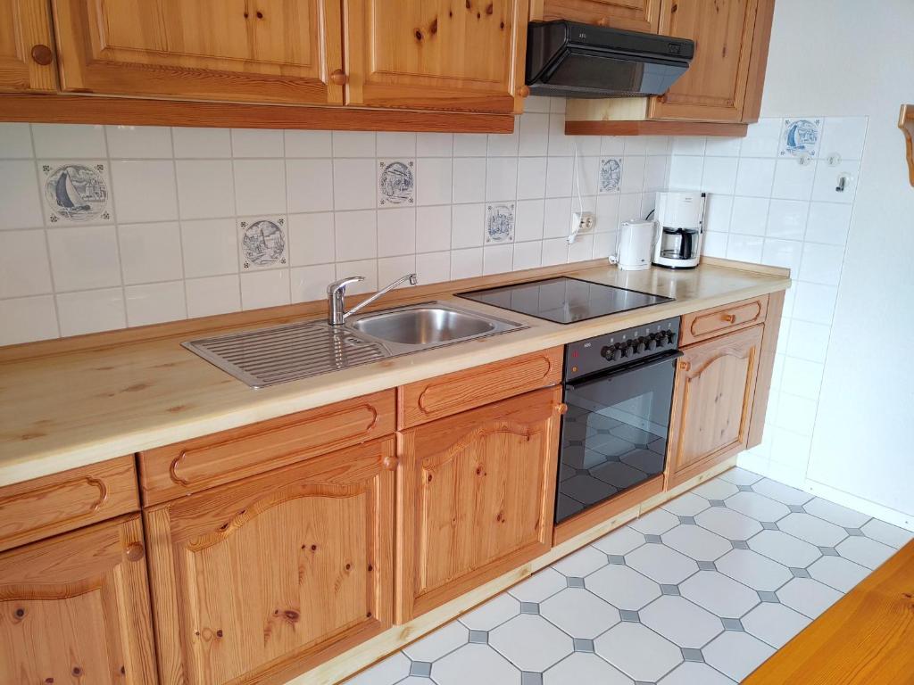 Kuchyň nebo kuchyňský kout v ubytování Ferienwohnung *Hafenblick*