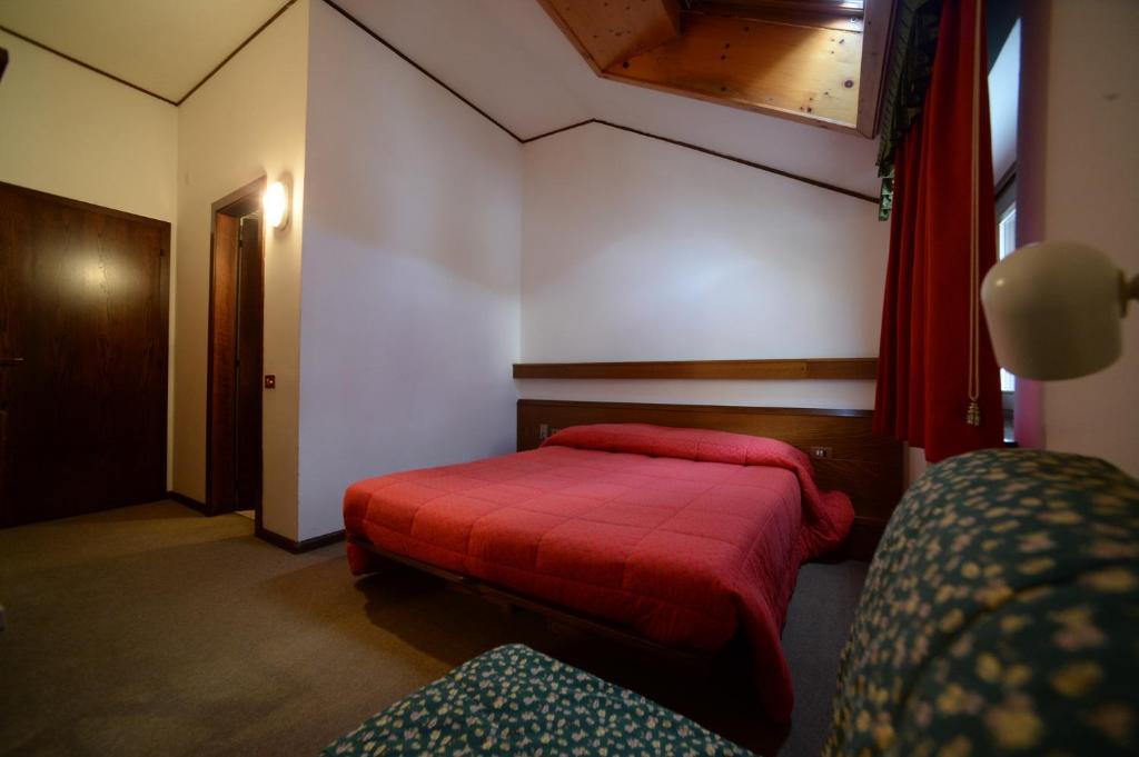 Postel nebo postele na pokoji v ubytování Hotel Compet