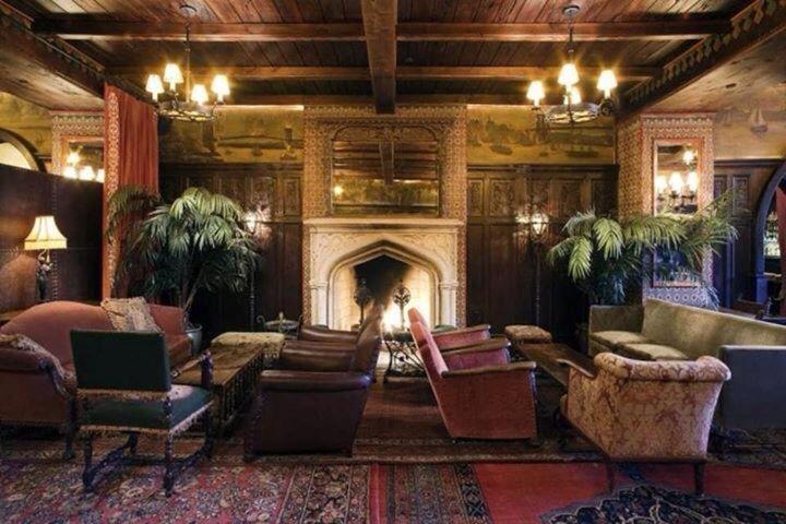 a large living room with a fireplace and furniture at The Lodge B&B in Jaipur