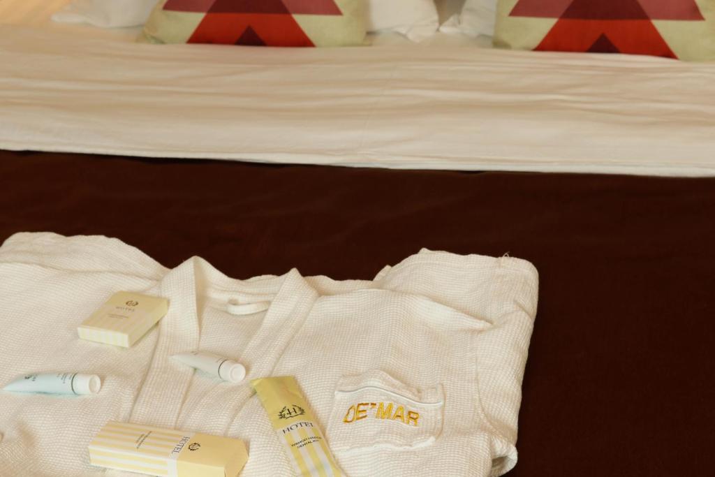 Postel nebo postele na pokoji v ubytování De'Mar Hotel