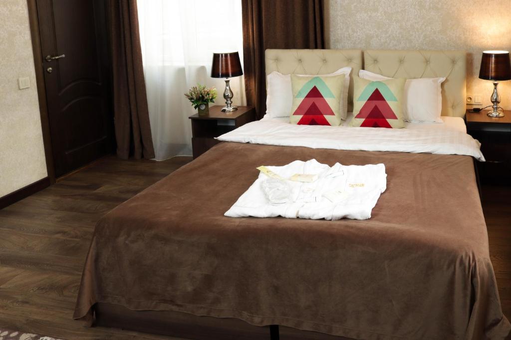 Postel nebo postele na pokoji v ubytování De'Mar Hotel
