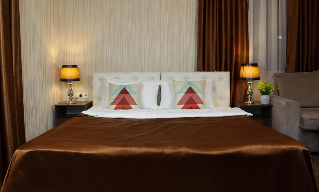 Postel nebo postele na pokoji v ubytování De'Mar Hotel