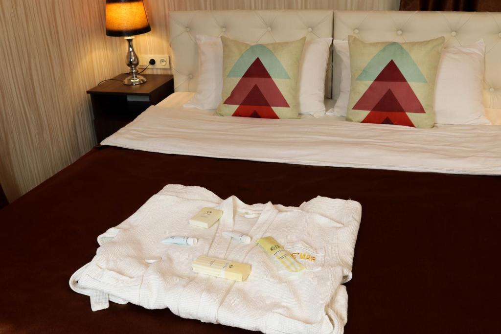 Postel nebo postele na pokoji v ubytování De'Mar Hotel