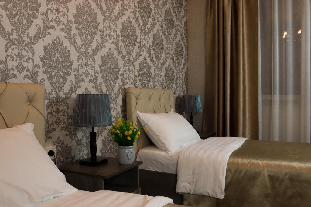 Postel nebo postele na pokoji v ubytování De'Mar Hotel