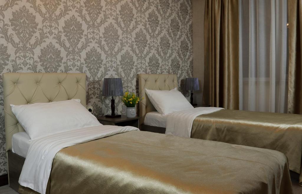Postel nebo postele na pokoji v ubytování De'Mar Hotel