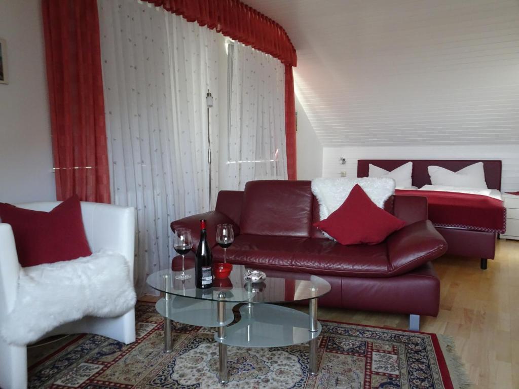 a living room with a couch and a table at Haus Holzheimer in Bad Kissingen