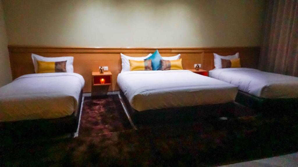Postel nebo postele na pokoji v ubytování Hotel Golden Flora