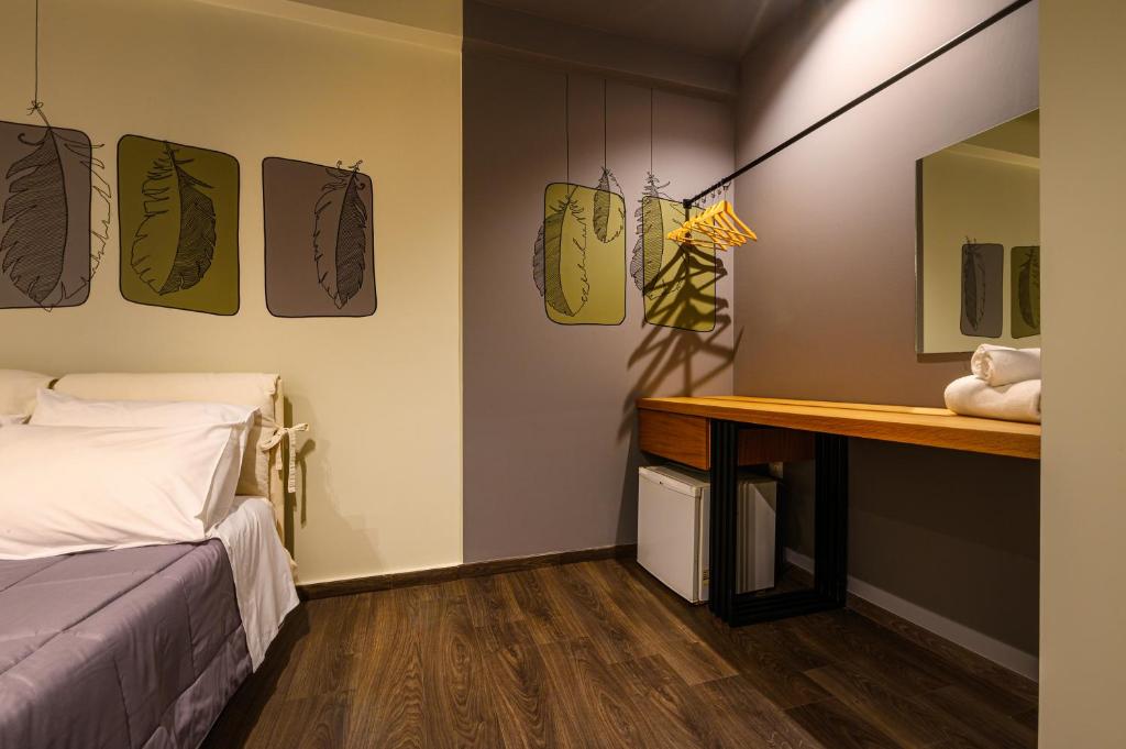 Postel nebo postele na pokoji v ubytování Kleopatra Inn