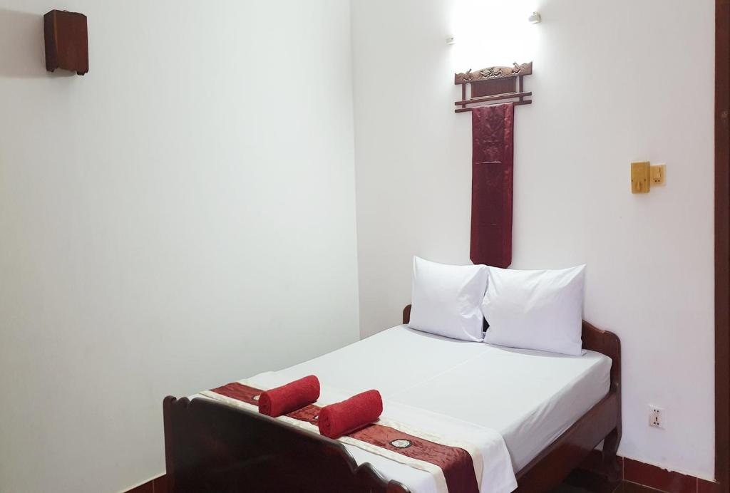 Postel nebo postele na pokoji v ubytování Smiley's Guesthouse