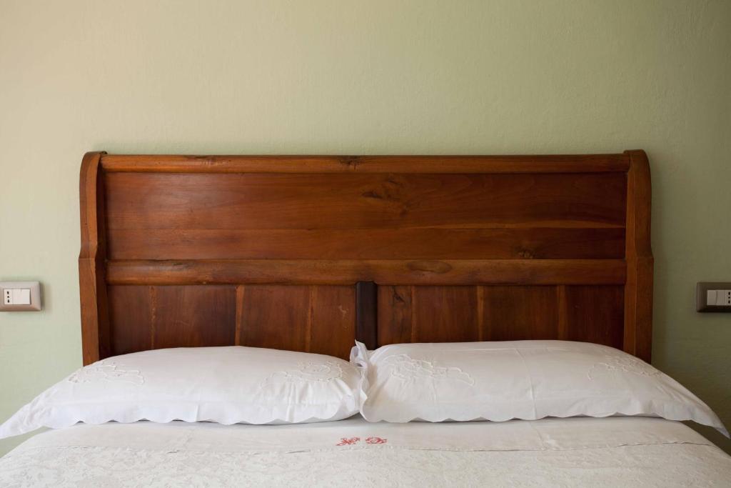 Postel nebo postele na pokoji v ubytování Albergo Diffuso Ca' Spiga