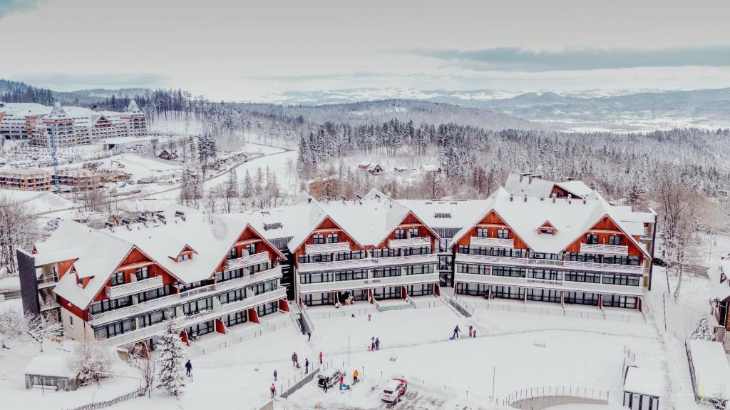 an aerial view of a resort in the snow at Apartament Malinowy Zakątek Triventi Mountain Residence in Karpacz