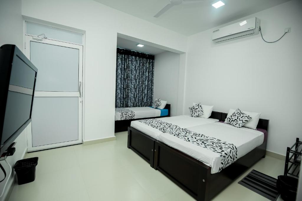 Postel nebo postele na pokoji v ubytování RoaBaa Guesthouse