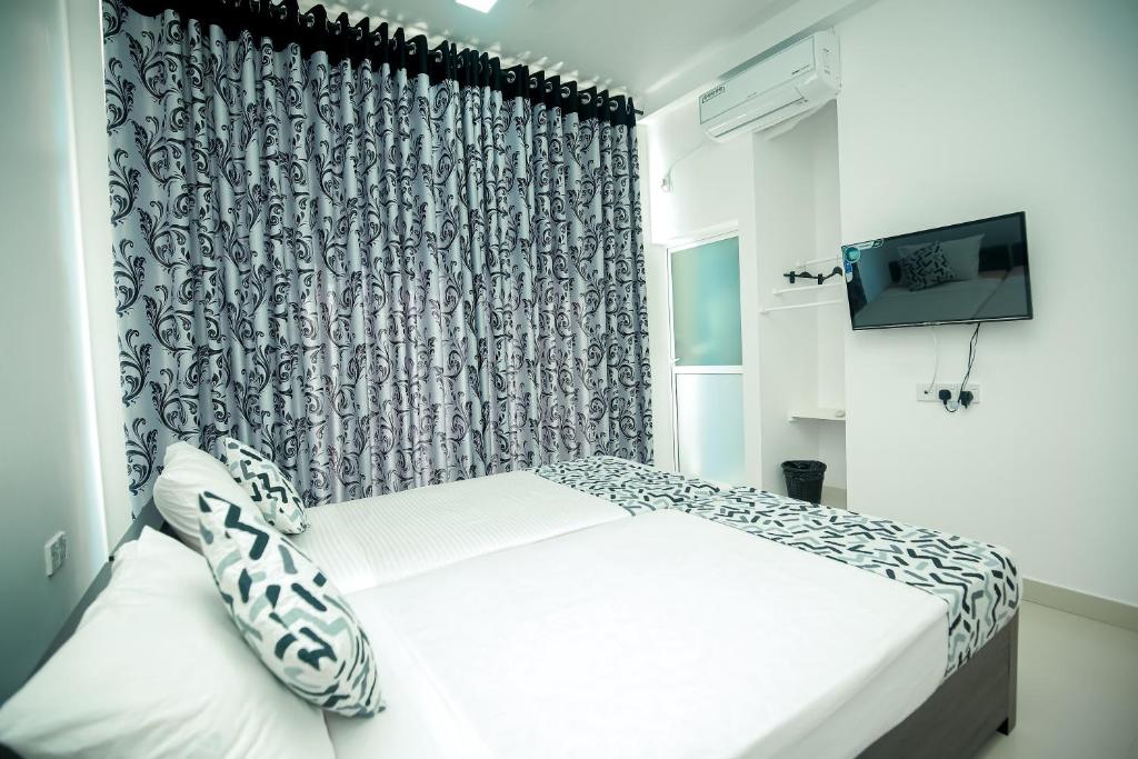 Postel nebo postele na pokoji v ubytování RoaBaa Guesthouse