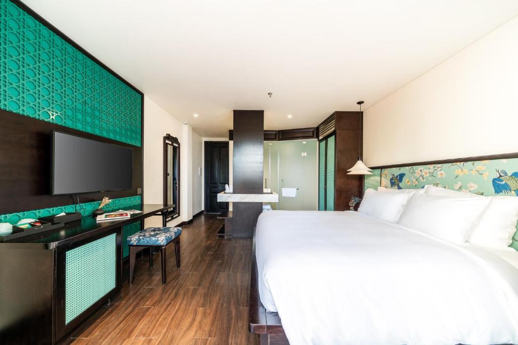 Postel nebo postele na pokoji v ubytování De An Hotel